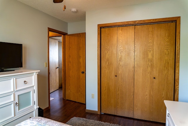 3700 10th Ave, Minot, ND 58701 - bedroom with a closet, dark wood-type flooring, and ceiling fan