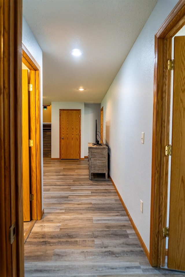 3700 10th Ave, Minot, ND 58701 - hallway with light wood-type flooring, recessed lighting, and baseboards