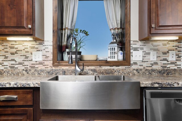 6351 53rd St, Plaza, ND 58771 - kitchen featuring stainless steel dishwasher, dark brown cabinetry, and decorative backsplash