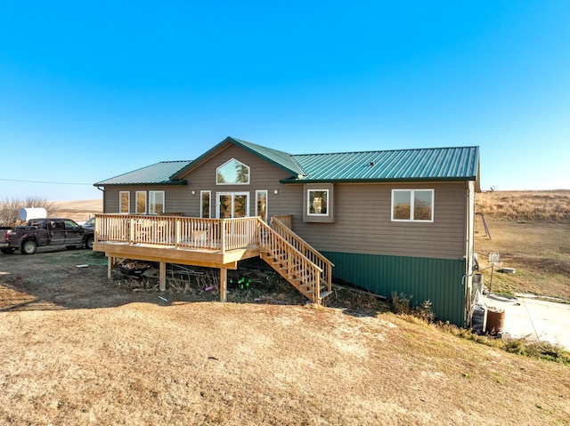 6351 53rd St, Plaza, ND 58771 - rear view of house with a deck and metal roof