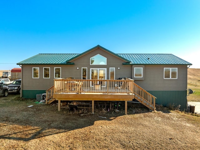 6351 53rd St, Plaza, ND 58771 - rear view of property with a deck, stairs, metal roof, and a cooling unit
