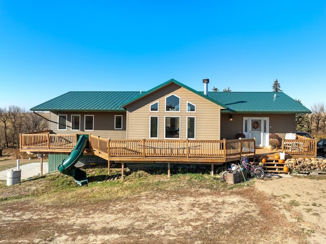 6351 53rd St, Plaza, ND 58771 - back of house with metal roof and a wooden deck