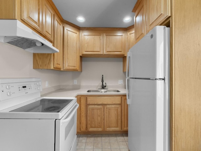 2301 2nd Ave Unit 2, Minot, ND 58701 - kitchen featuring white appliances, a sink, under cabinet range hood, light tile patterned floors, and light countertops