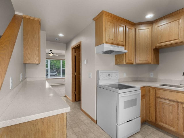 2301 2nd Ave Unit 2, Minot, ND 58701 - kitchen featuring white range with electric cooktop, under cabinet range hood, a sink, light countertops, and ceiling fan