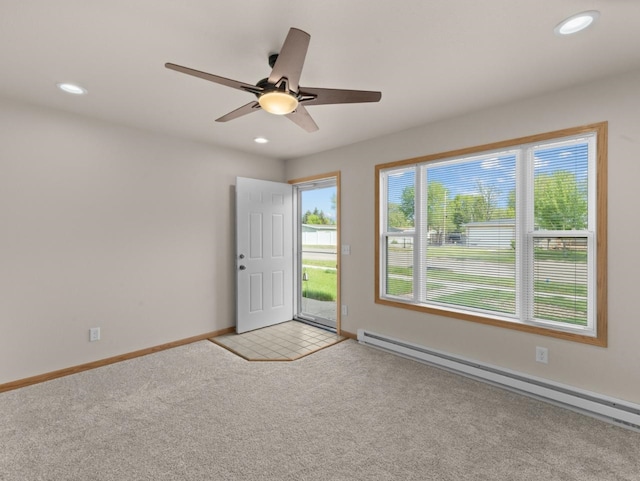 2301 2nd Ave Unit 2, Minot, ND 58701 - spare room with a baseboard heating unit, light carpet, recessed lighting, ceiling fan, and baseboards