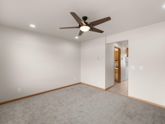 2301 2nd Ave Unit 2, Minot, ND 58701 - empty room with a ceiling fan, light colored carpet, recessed lighting, and baseboards