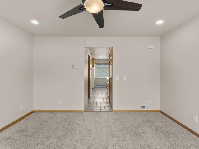 2301 2nd Ave Unit 2, Minot, ND 58701 - carpeted spare room featuring baseboards, ceiling fan, and recessed lighting