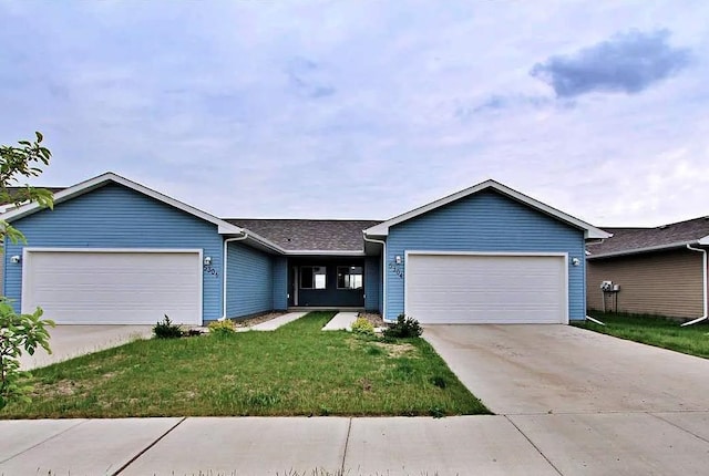 5304 15th Ave, Minot, ND 58701 - ranch-style house with an attached garage, concrete driveway, and a front yard