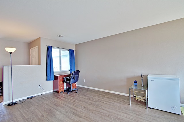 5304 15th Ave, Minot, ND 58701 - unfurnished office featuring wood finished floors and baseboards