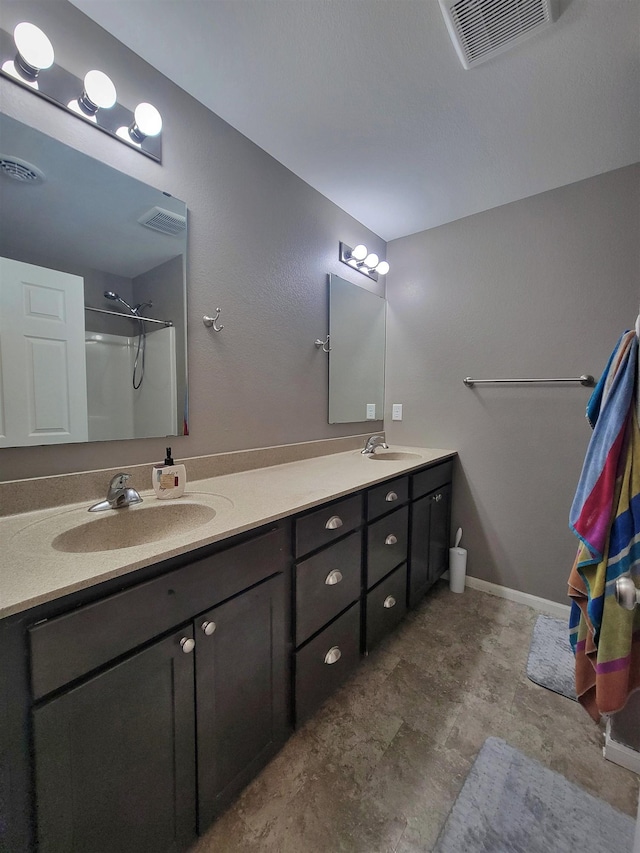 5304 15th Ave, Minot, ND 58701 - bathroom with double vanity and a shower