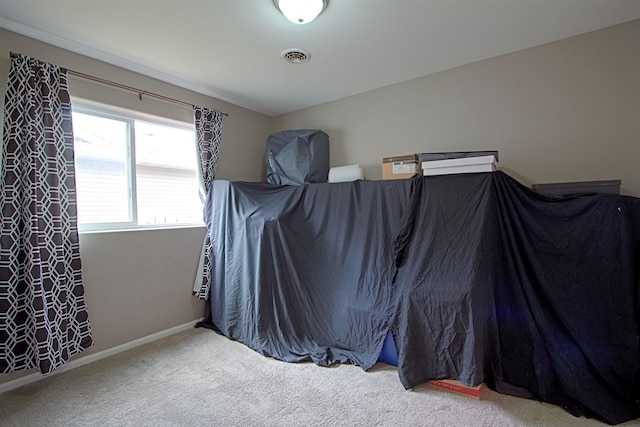 5304 15th Ave, Minot, ND 58701 - bedroom with carpet and baseboards
