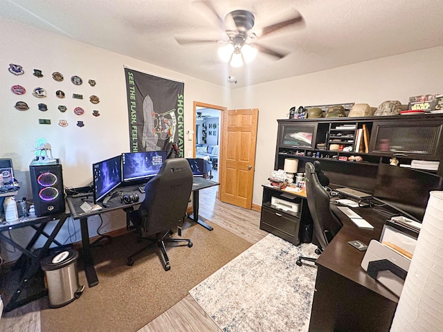 101 6th St, Minot, ND 58703 - home office featuring light wood-type flooring and a ceiling fan