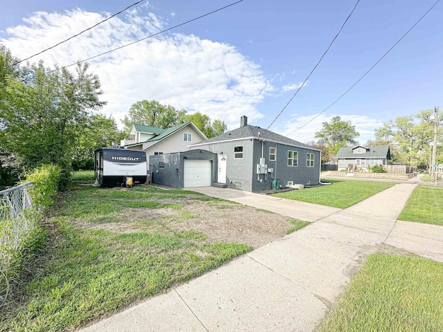101 6th St, Minot, ND 58703 - view of property exterior with concrete driveway and an attached garage
