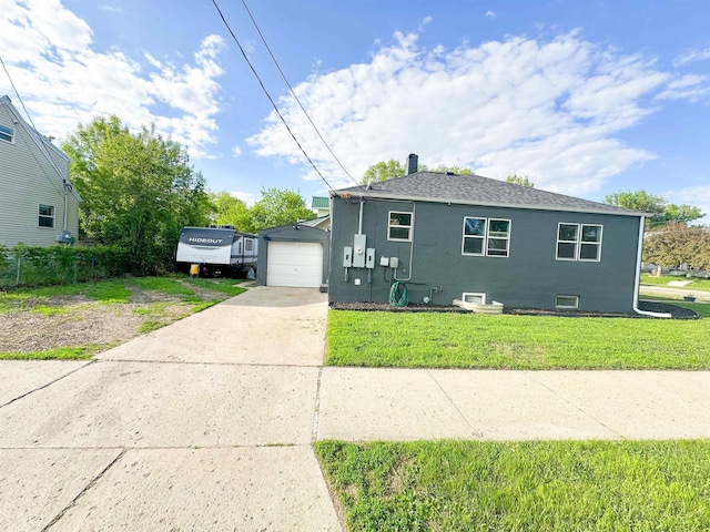 101 6th St, Minot, ND 58703 - view of front facade with driveway, a front yard, and stucco siding
