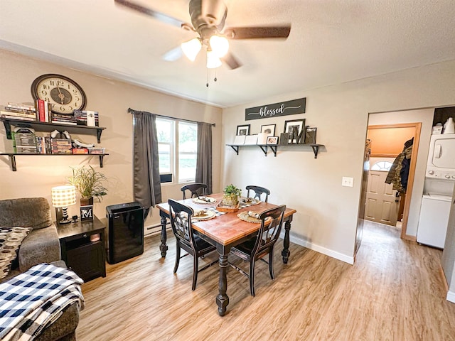 101 6th St, Minot, ND 58703 - dining space featuring stacked washing machine and dryer, light wood finished floors, a ceiling fan, and baseboards