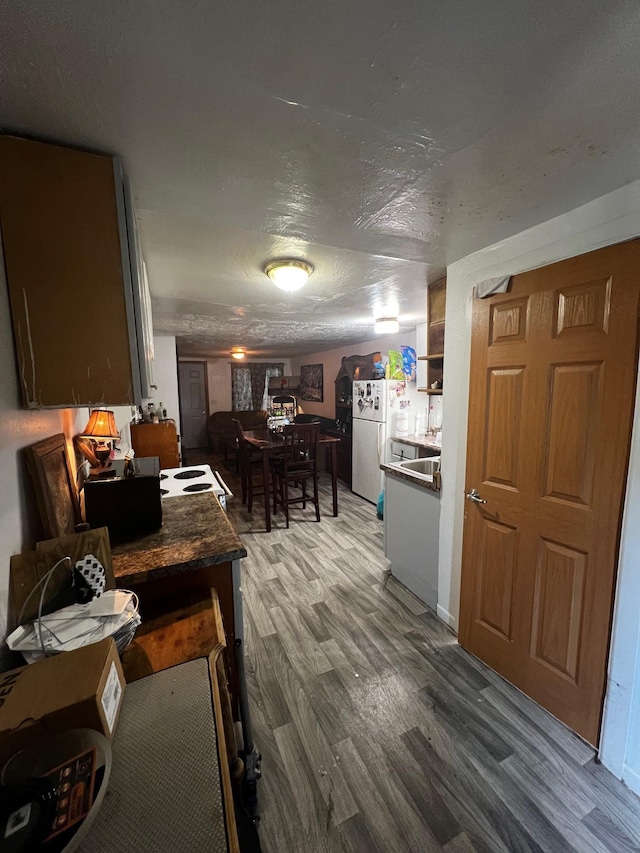 622 Central Ave, Minot, ND 58701 - dining room with wood finished floors and a textured ceiling