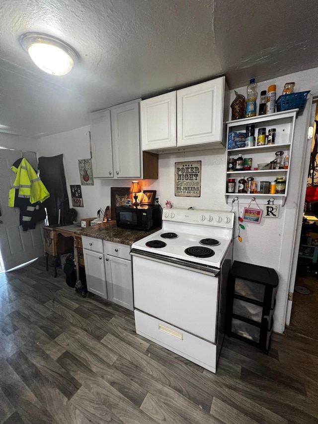 622 Central Ave, Minot, ND 58701 - kitchen with white electric range, black microwave, white cabinets, a textured ceiling, and dark wood finished floors