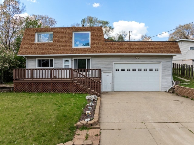 1127 8th St, Minot, ND 58703 - view of front facade featuring a shingled roof, driveway, and a garage