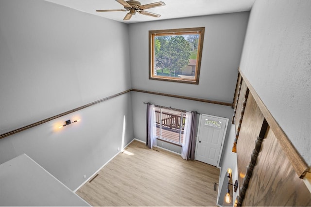 1127 8th St, Minot, ND 58703 - foyer entrance featuring wood finished floors and a ceiling fan