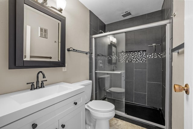 1127 8th St, Minot, ND 58703 - bathroom with toilet, a shower stall, and vanity