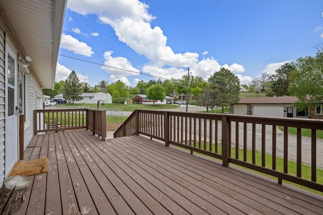 1127 8th St, Minot, ND 58703 - wooden deck featuring a residential view