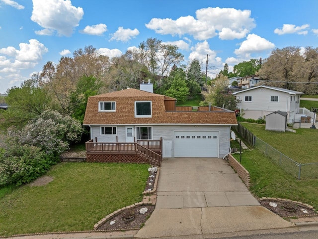1127 8th St, Minot, ND 58703 - view of front of property featuring concrete driveway, a deck, roof with shingles, an attached garage, and a chimney
