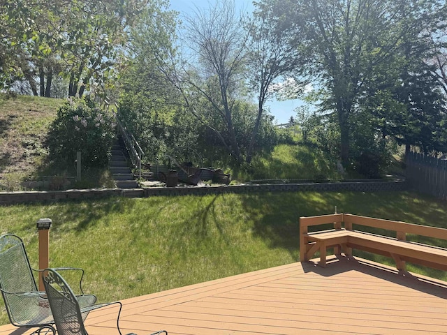1130 8th St, Minot, ND 58703 - wooden terrace featuring stairs and a yard