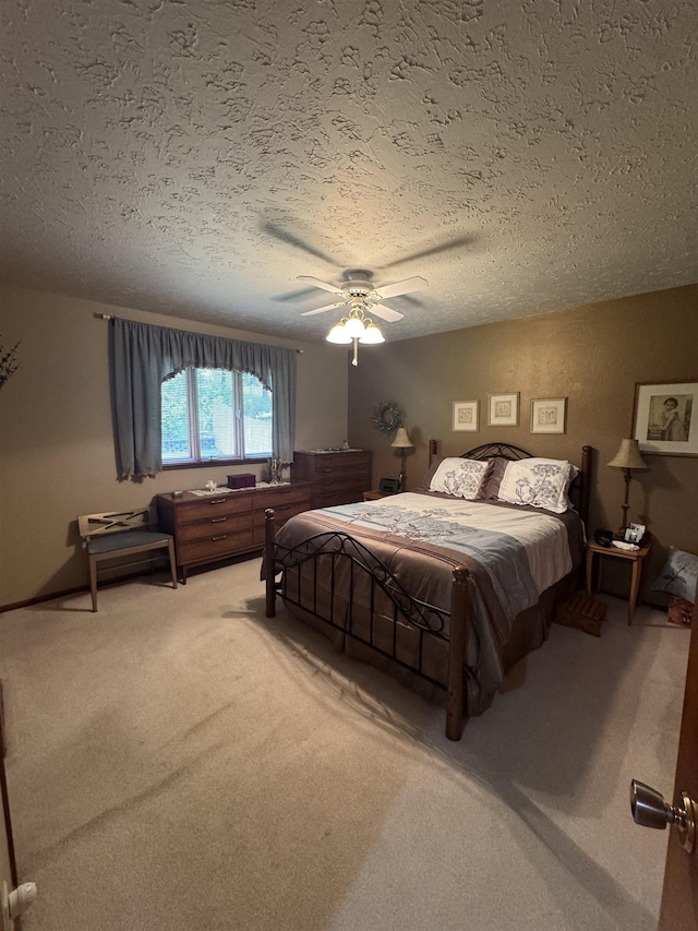 1130 8th St, Minot, ND 58703 - carpeted bedroom with a textured ceiling and a ceiling fan