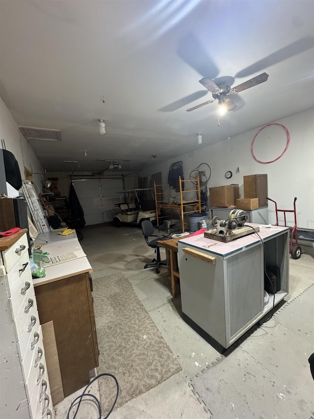 1130 8th St, Minot, ND 58703 - miscellaneous room with concrete flooring and ceiling fan