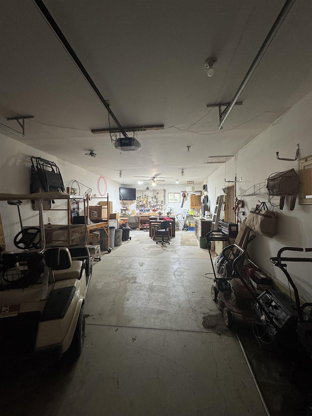 1130 8th St, Minot, ND 58703 - garage with a garage door opener and a workshop area
