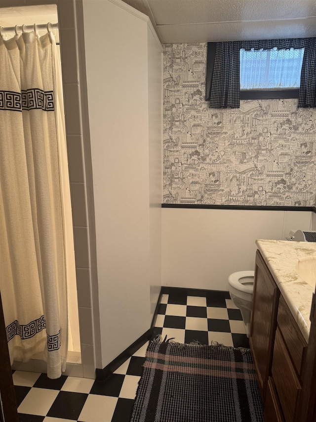1130 8th St, Minot, ND 58703 - full bathroom with tile patterned floors, toilet, wallpapered walls, vanity, and a shower with curtain