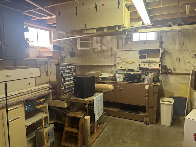 1130 8th St, Minot, ND 58703 - below grade area featuring a workshop area and a wall mounted air conditioner
