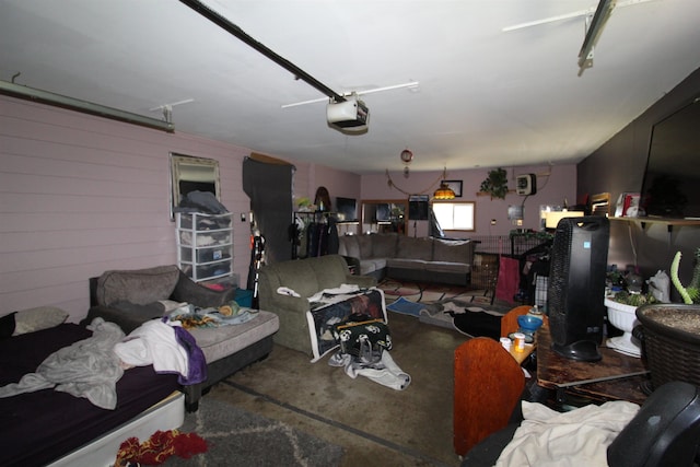 506 W Ave, Granville, ND 58741 - living room featuring concrete flooring and a garage