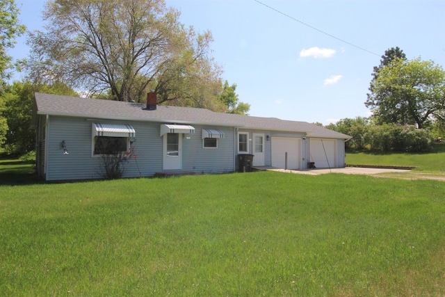 506 W Ave, Granville, ND 58741 - view of front of house with driveway, a front lawn, a garage, and a chimney