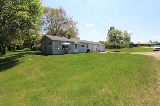 506 W Ave, Granville, ND 58741 - single story home featuring a front yard, driveway, and a chimney