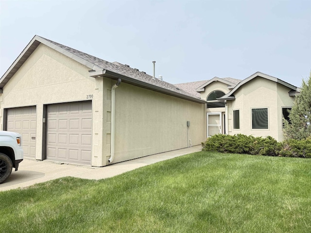 2700 18th Ave, Minot, ND 58701 - view of front of home with stucco siding, a front lawn, and a shingled roof