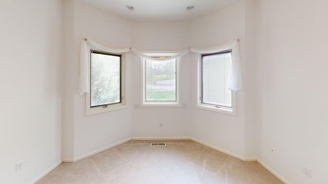 2700 18th Ave, Minot, ND 58701 - empty room with light colored carpet and baseboards