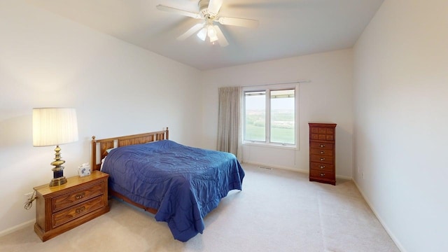 2700 18th Ave, Minot, ND 58701 - bedroom with light carpet, baseboards, and ceiling fan