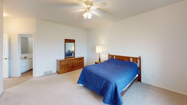 2700 18th Ave, Minot, ND 58701 - bedroom featuring light carpet, connected bathroom, ceiling fan, and baseboards