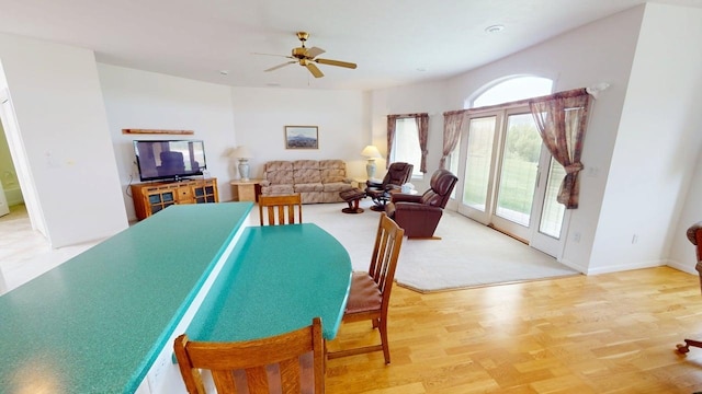 2700 18th Ave, Minot, ND 58701 - dining space featuring a ceiling fan, wood finished floors, and baseboards