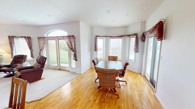 2700 18th Ave, Minot, ND 58701 - dining space with light wood-style floors and baseboards