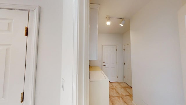 2700 18th Ave, Minot, ND 58701 - hallway featuring light tile patterned floors and rail lighting