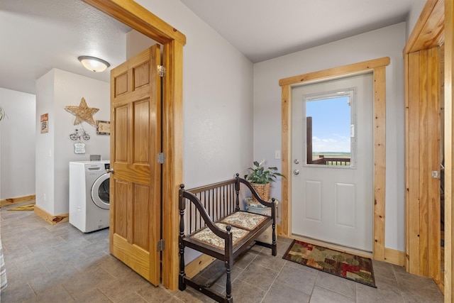 1164 100th St, Bottineau, ND 58318 - laundry area with washer / clothes dryer and baseboards