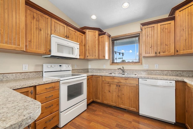 1600 16th St, Minot, ND 58701 - kitchen featuring white appliances, a sink, light countertops, dark wood finished floors, and recessed lighting