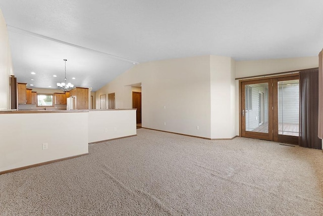 1600 16th St, Minot, ND 58701 - unfurnished living room with lofted ceiling, a chandelier, baseboards, light colored carpet, and recessed lighting