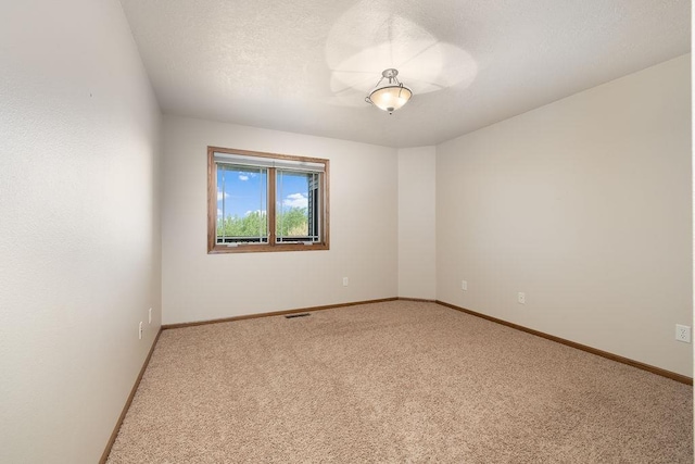 1600 16th St, Minot, ND 58701 - carpeted spare room featuring baseboards