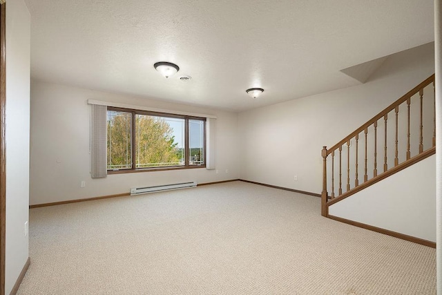 1600 16th St, Minot, ND 58701 - unfurnished room featuring baseboard heating, baseboards, carpet floors, and stairs