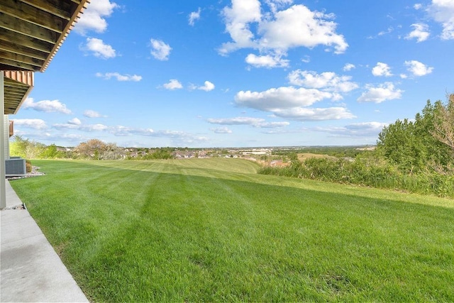 1600 16th St, Minot, ND 58701 - view of green lawn featuring central AC unit and golf course view
