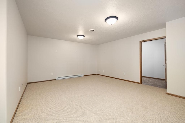 1600 16th St, Minot, ND 58701 - spare room with a baseboard radiator, light carpet, and baseboards