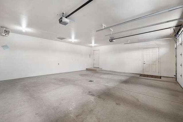1600 16th St, Minot, ND 58701 - garage featuring a garage door opener